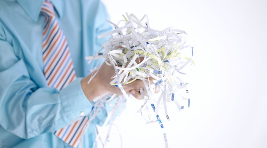 Someone holding shredded paper