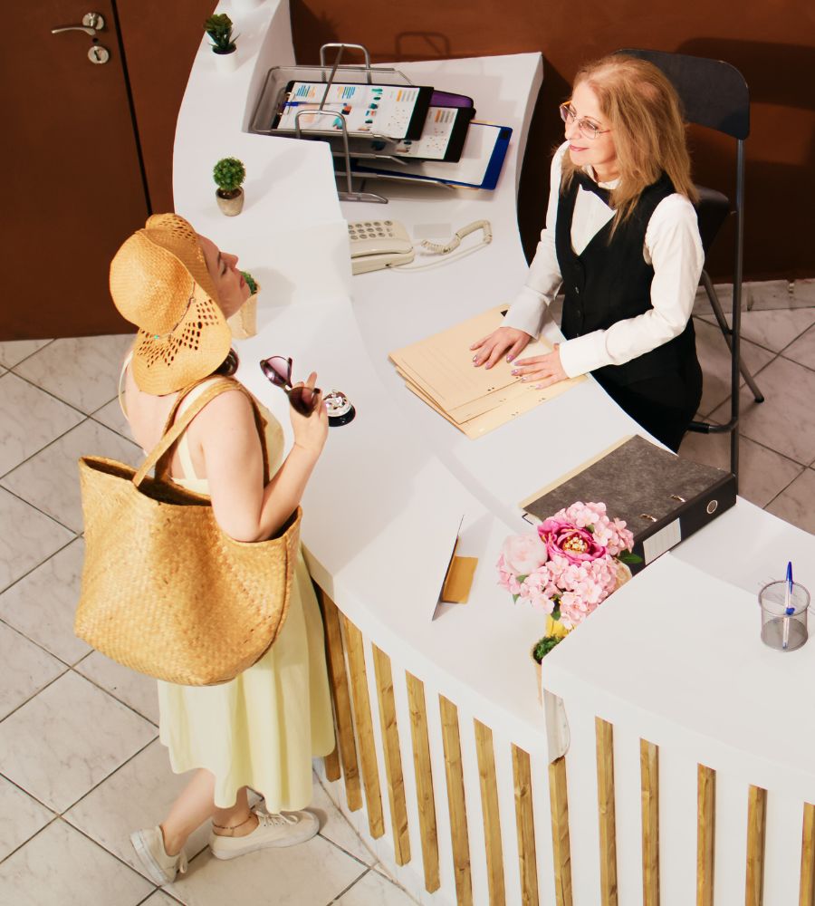hotel employee helping a guest